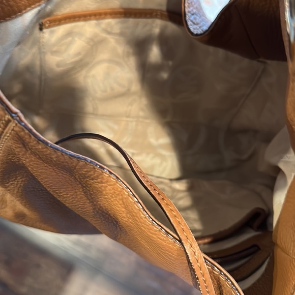 Michael Kors tan leather purse. Gold emblem. Gently used
Snap closure dust bag - Picture 6 of 9